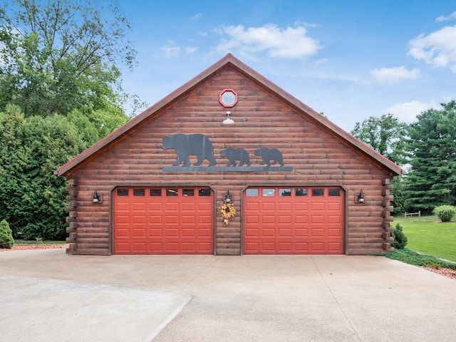 exterior space with an outbuilding and a garage