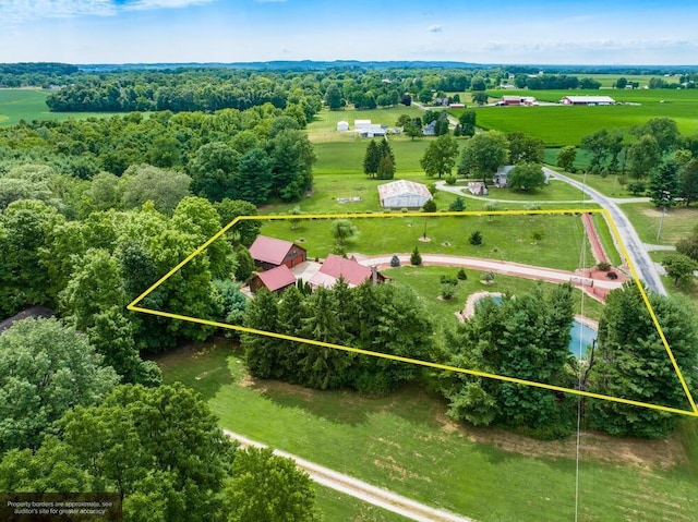 birds eye view of property with a rural view