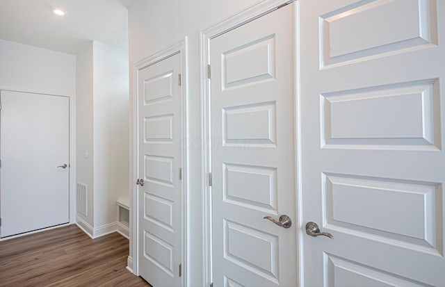 details with visible vents, baseboards, and wood finished floors