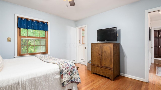 bedroom featuring ceiling fan and light wood-type flooring