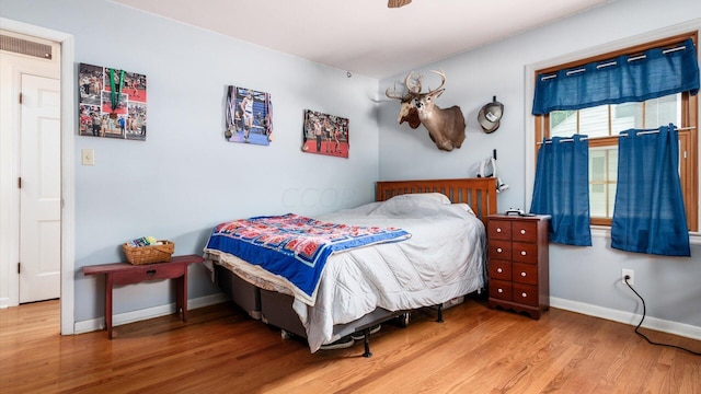 bedroom featuring wood-type flooring