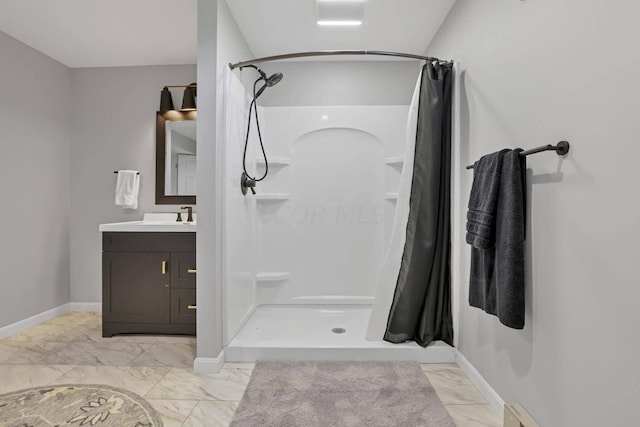 bathroom with vanity, curtained shower, and a baseboard heating unit