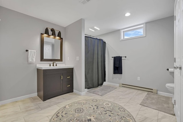 bathroom featuring a shower with curtain, vanity, toilet, and baseboard heating