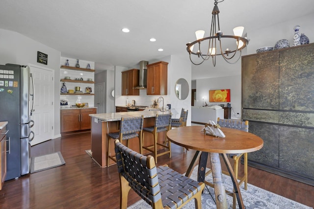 dining room featuring a chandelier and dark wood-type flooring