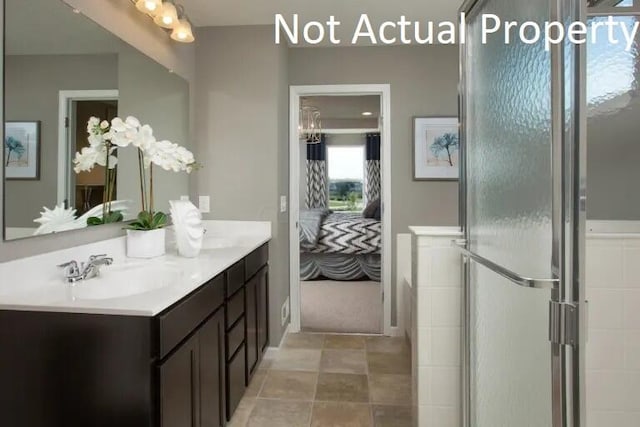 bathroom with vanity and an enclosed shower