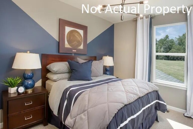 bedroom with light colored carpet and lofted ceiling