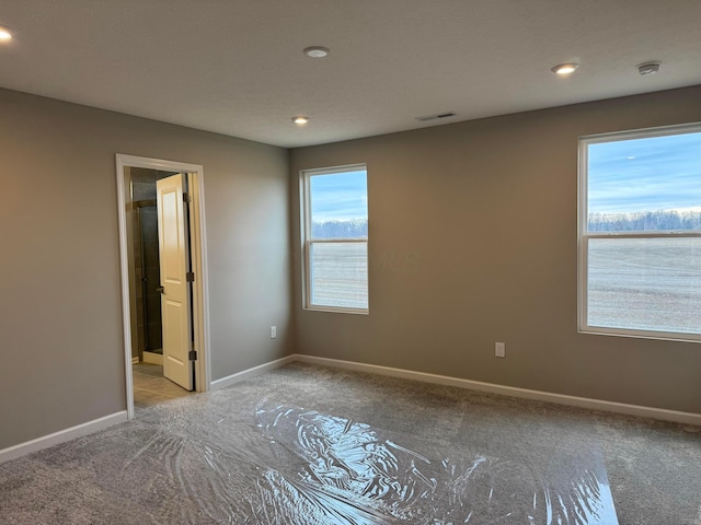 unfurnished bedroom featuring ensuite bathroom