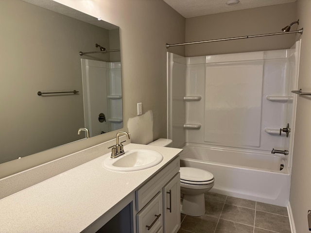 full bathroom with vanity, tile patterned flooring, toilet, a textured ceiling, and tub / shower combination