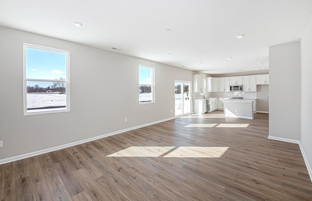 unfurnished living room with light hardwood / wood-style flooring