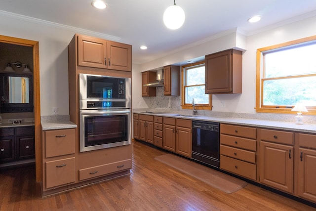 kitchen with oven, dishwasher, plenty of natural light, and sink