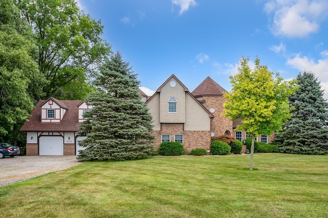 view of front of home featuring a front lawn and a garage