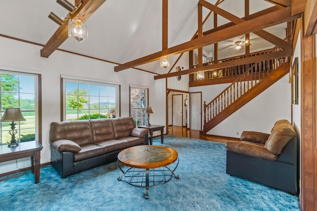 living room with hardwood / wood-style floors, beam ceiling, and high vaulted ceiling