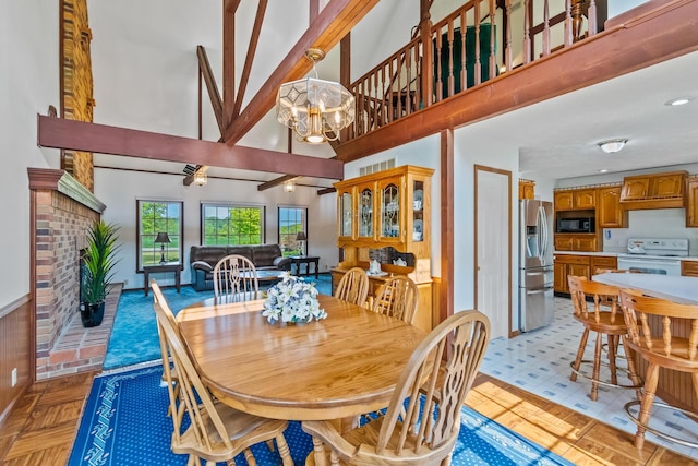 dining area featuring light parquet flooring and an inviting chandelier