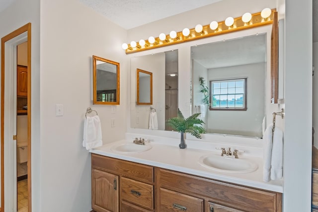 bathroom featuring vanity and a textured ceiling