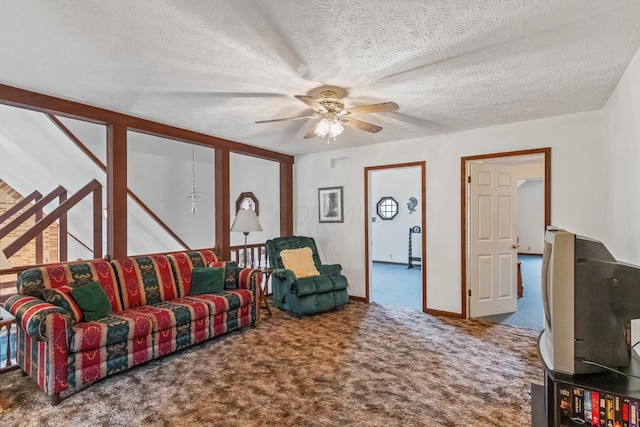 carpeted living room with ceiling fan and a textured ceiling