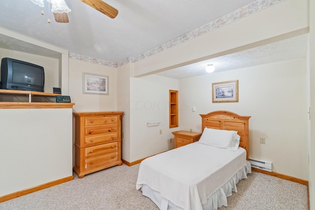 bedroom featuring ceiling fan, a baseboard radiator, a textured ceiling, and light carpet