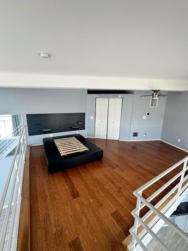 unfurnished bedroom with dark wood-type flooring