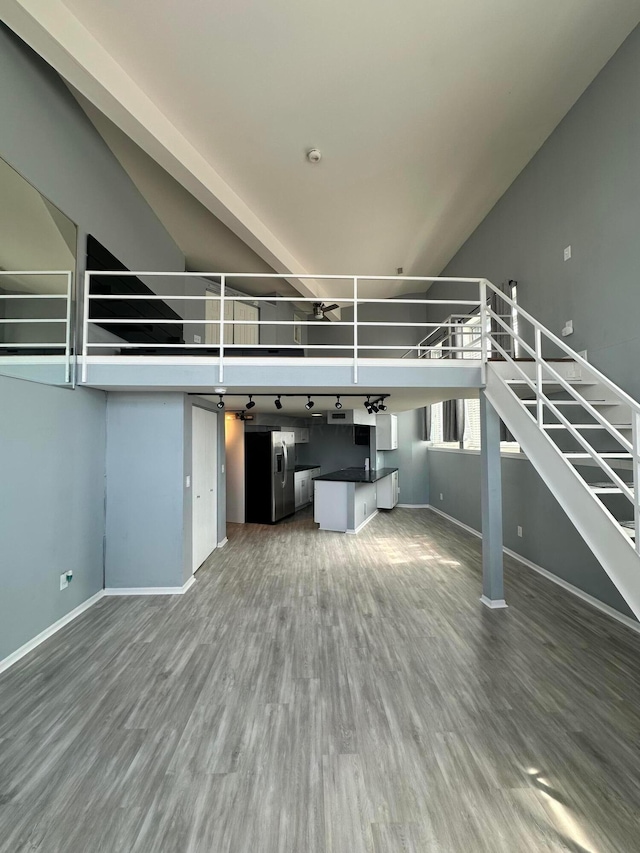 unfurnished living room featuring wood-type flooring