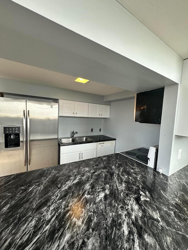 kitchen with white cabinetry, sink, dishwasher, stainless steel refrigerator with ice dispenser, and range