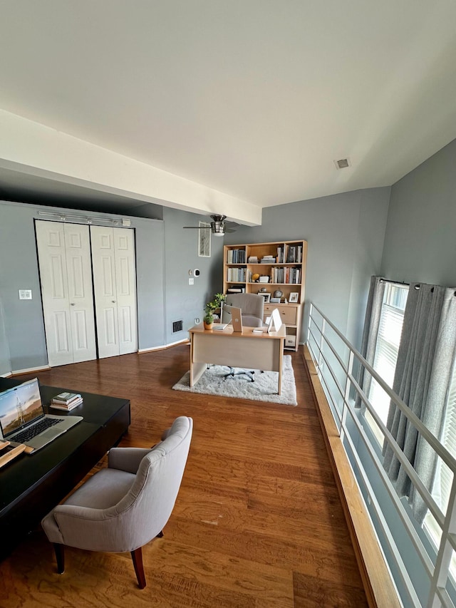 office space featuring ceiling fan and dark wood-type flooring