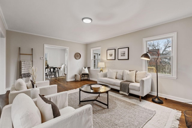 living room with dark hardwood / wood-style flooring and crown molding