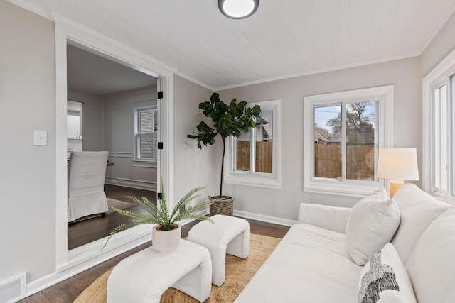 living room featuring ornamental molding and dark wood-type flooring