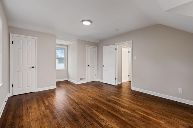 bonus room featuring dark hardwood / wood-style flooring and lofted ceiling