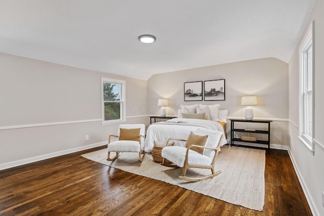 bedroom featuring dark hardwood / wood-style floors and vaulted ceiling