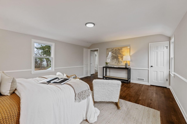 bedroom featuring dark hardwood / wood-style flooring and vaulted ceiling