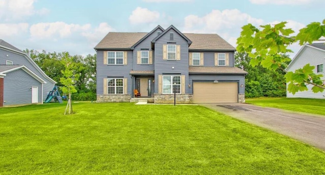 view of front of house with a front lawn, a playground, and a garage