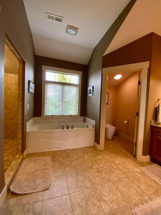 full bathroom with a garden tub, visible vents, toilet, vaulted ceiling, and tiled shower