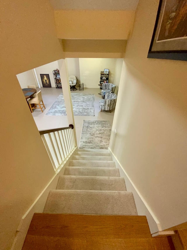 stairway featuring baseboards