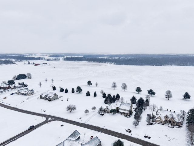 snowy aerial view with a rural view