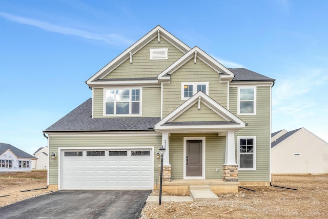 craftsman inspired home featuring a garage