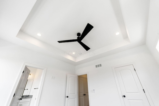 interior details with a tray ceiling