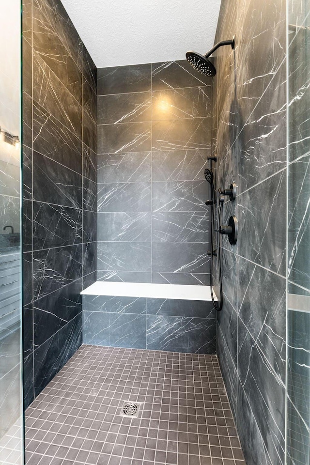 bathroom featuring a tile shower