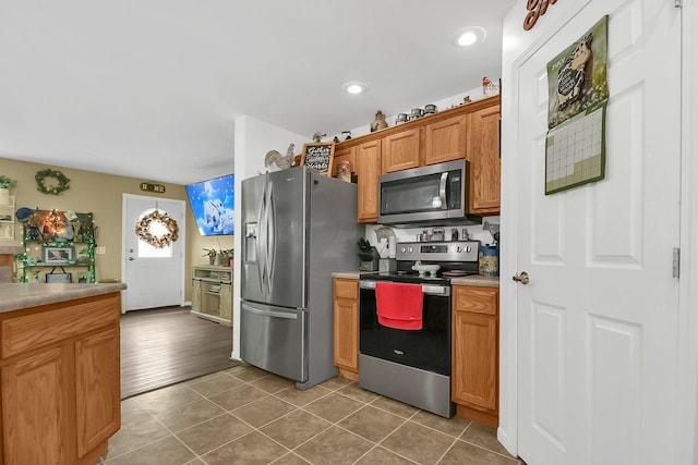 kitchen featuring stainless steel appliances and wood-type flooring