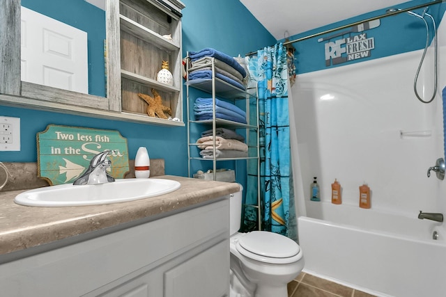 full bathroom featuring tile patterned floors, shower / tub combo with curtain, vanity, and toilet