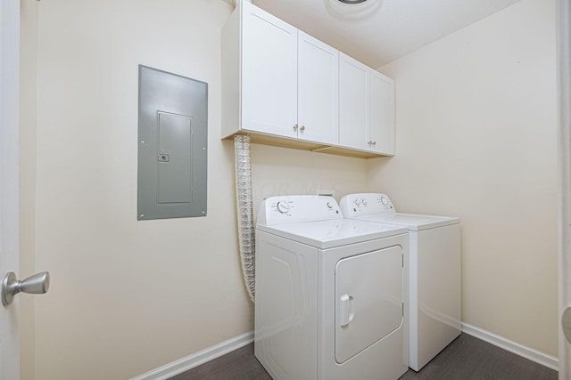 laundry room featuring cabinets, electric panel, and washer and dryer