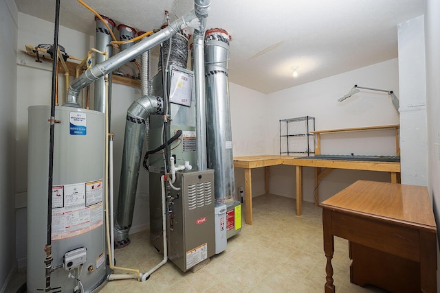 utility room featuring gas water heater