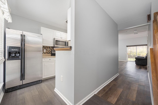 corridor featuring hardwood / wood-style floors