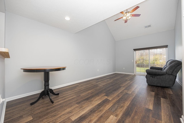 sitting room with dark hardwood / wood-style flooring, high vaulted ceiling, and ceiling fan