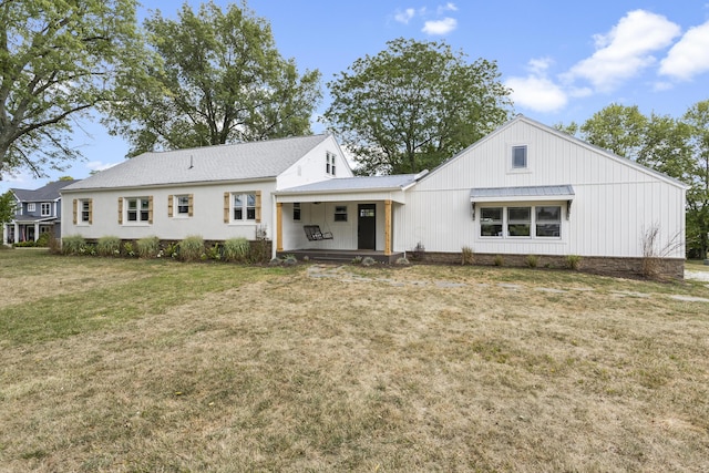 view of front of home with a front lawn and a porch