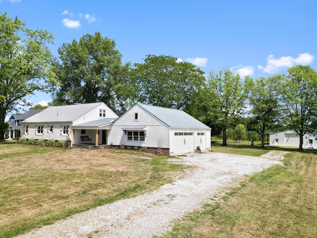 modern farmhouse style home with a garage and a front lawn