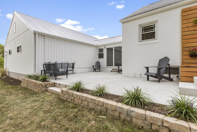 back of property with a patio