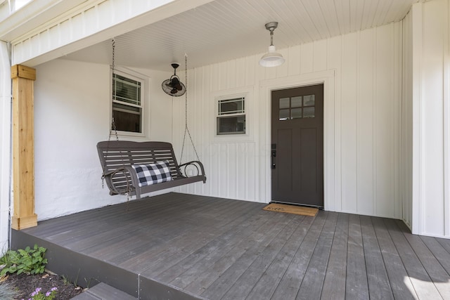 doorway to property featuring a wooden deck