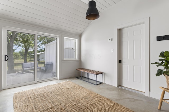 entryway featuring wooden ceiling, concrete floors, and lofted ceiling