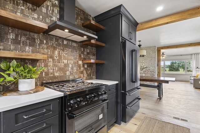 kitchen with beam ceiling, ceiling fan, ventilation hood, light hardwood / wood-style floors, and high end appliances