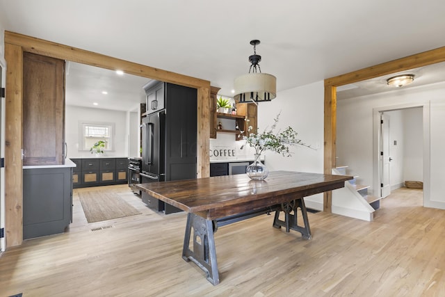 dining space featuring light wood-type flooring