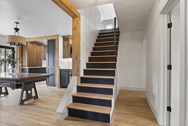 staircase featuring wood-type flooring